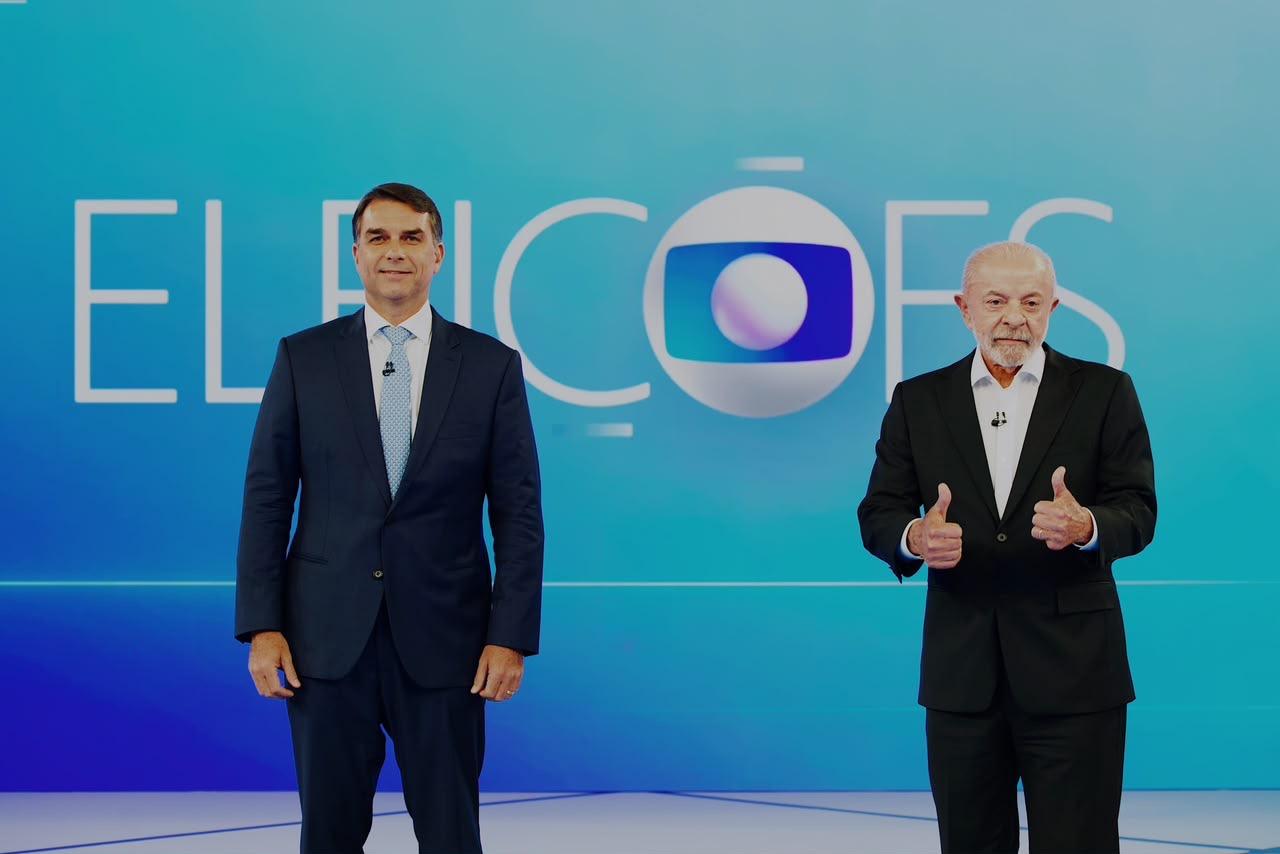 Lula e Flávio Bolsonaro trocam ofensas em debate na Globo e discutem dívidas, salário mínimo e SUS